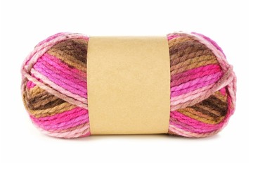 Multicolored knitting yarn with blank paper label isolated