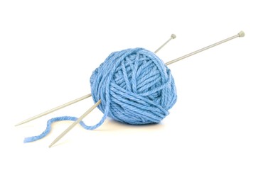 Ball of blue yarn with knitting needles isolated on white
