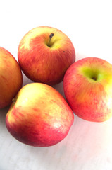 Red apples on a white background