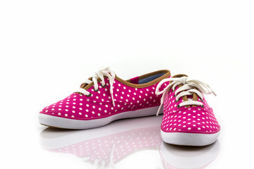 Pink polka dot canvas shoe .