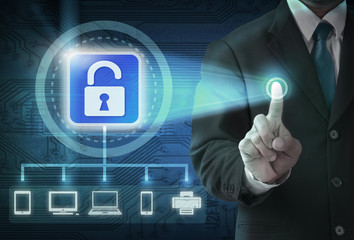 Hand pushing virtual security button on digital background