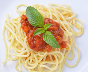 Spaghetti Bolognese with cheese and basil