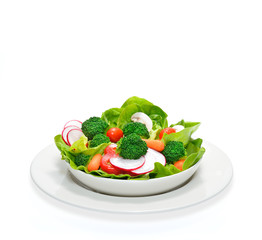Fruit and vegetable salad in a bowl isolated on white