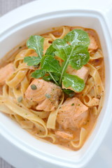 Salmon spaghetti with orange sauce