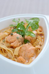 Salmon spaghetti with orange sauce