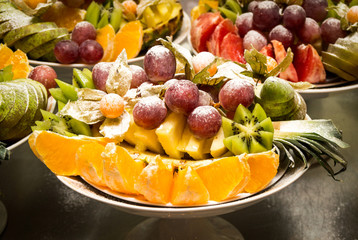 Assorted fruits of grapes, kiwi, oranges and pineapple
