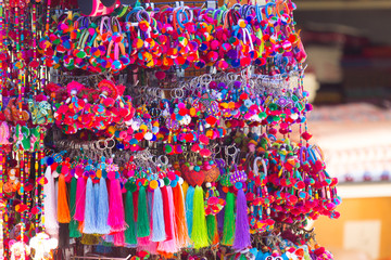 Colorful yarn keychain in lanna style in market