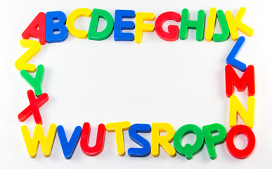 Frame magnet alphabet on white background