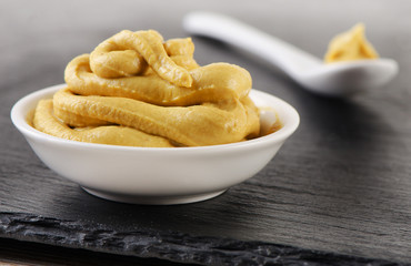 Mustard sauce in  white bowl