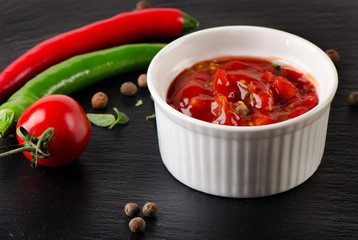 Bowl of salsa dip with peppers