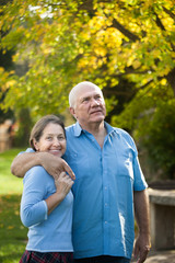 mature couple  in autumn park.