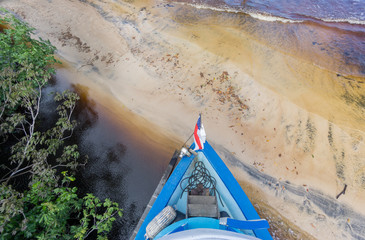 Boat arrives to sand beach