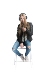 Isolated on white cute teenager girl in wired headphones