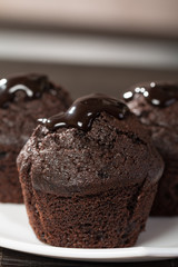 spongecake or muffin with chocolate sauce
