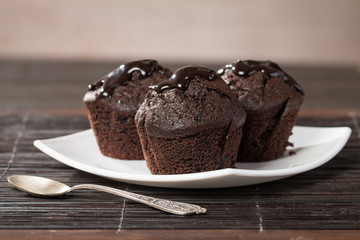 spongecake or muffin with chocolate sauce