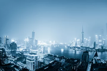 Foto auf Leinwand night shanghai skyline with reflection ,beautiful modern city © snvv