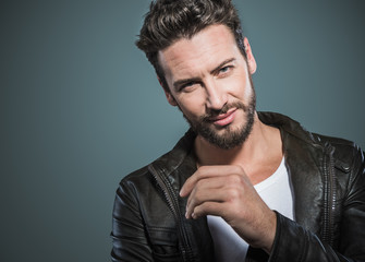 Cool attractive man in leather jacket