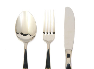 Metal fork, knife and spoon on white background.