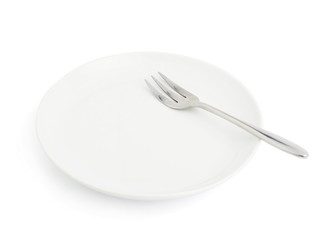 Knife and fork over the plate isolated