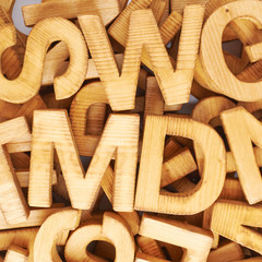 Surface covered with multiple wooden letters