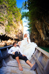 blonde bride and handsome groom on boat © alkiona_25