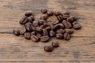 Coffee beans on wood texture