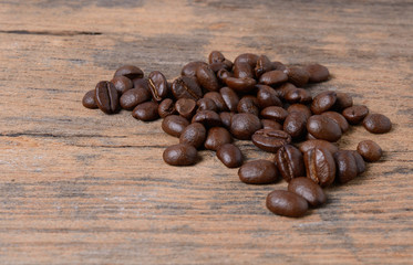 Coffee beans on wood texture