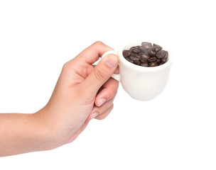 female hand hold cup of coffee beans isolated on white backgroun