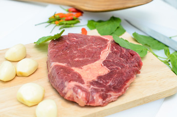 Raw Fresh Meat Slices on Wooden Chopping Board