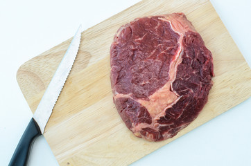 Raw Fresh Meat Slices on Wooden Chopping Board