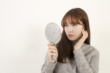 Woman looking at her reflection
