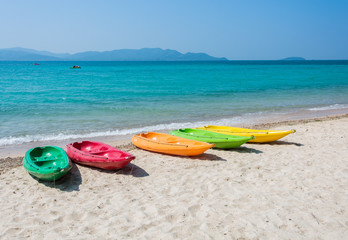 Colorful kayak on tropical beach