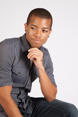 Black man looking thoughtful