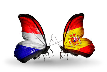Two butterflies with flags Holland and Spain