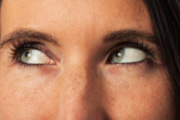 Fototapeta premium close up on young woman face, view in the top left