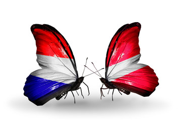 Two butterflies with flags Holland and Latvia