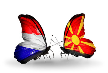 Two butterflies with flags Holland and Macedonia