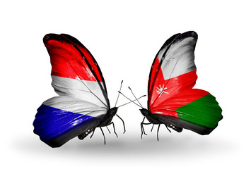 Two butterflies with flags Holland and Oman
