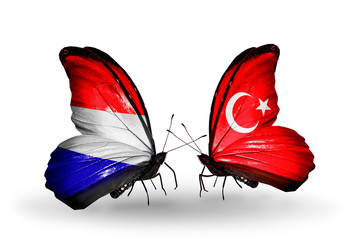 Two butterflies with flags Holland and Turkey