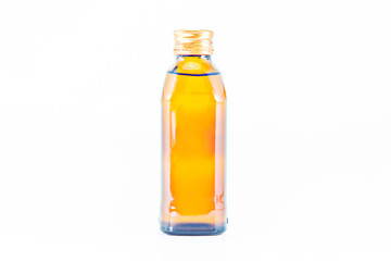 yellow glass bottle on a white background.