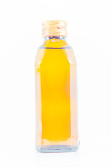 yellow glass bottle on a white background.