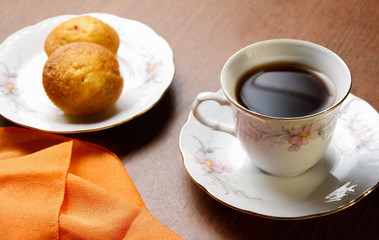 Tea cup with sweet cookie and book