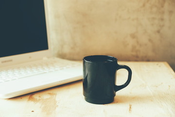 vintage color tone : cup of coffee in coffee shop