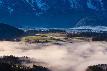 Morning fog in the valley in the Austrian Alps
