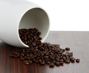 Coffee bean on wood texture isolated on white background