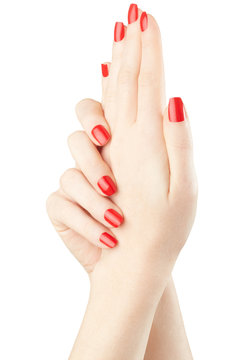 Manicure on female hands with red nail polish, clipping path