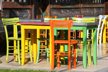 Fototapeta na wymiar Set of colorful tables and chairs