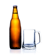 bottle of beer and empty Glass isolated on a white background