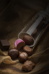 Handmade luxury chocolates in a glass tube
