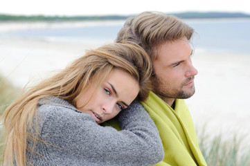 Romantic seaside lovely couple in sand dune - autumn, beach